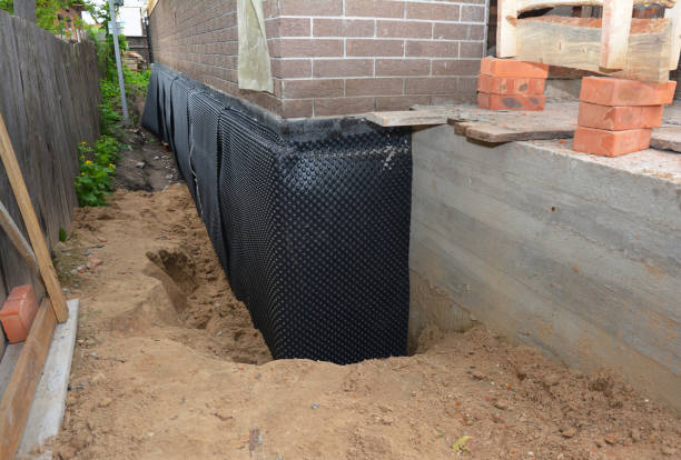 Happy homeowners after waterproofing job in Meridianville